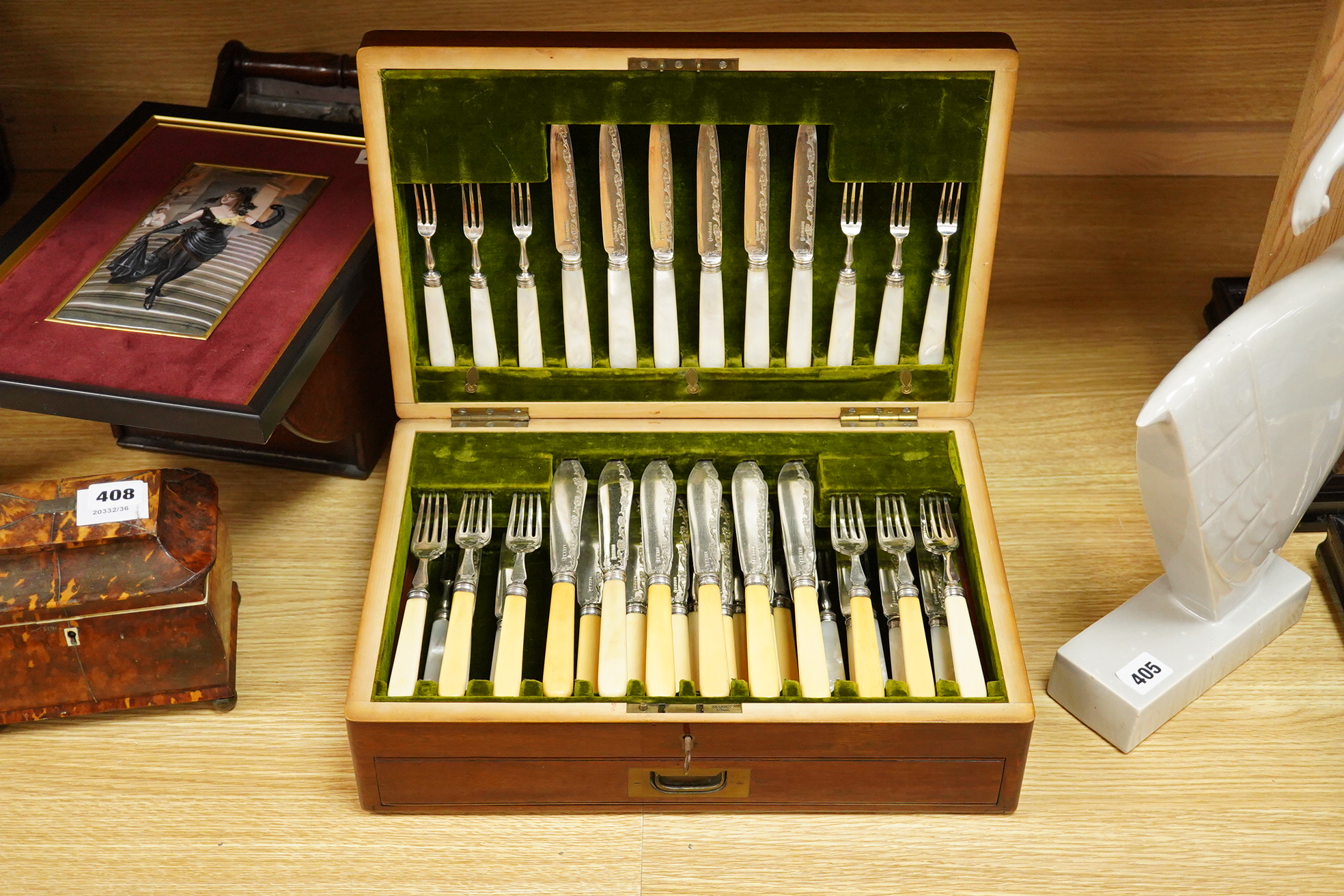 A set of six late Victorian bone handled fish knives and forks and a set of twelve mother of pearl handled dessert knives and forks, mahogany cased
